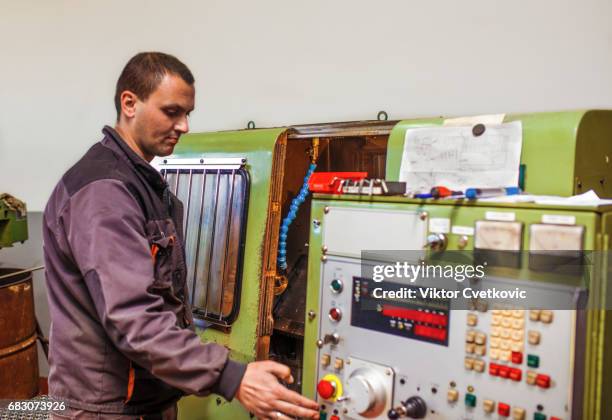 worker control cnc machine production - milling cutter stock pictures, royalty-free photos & images