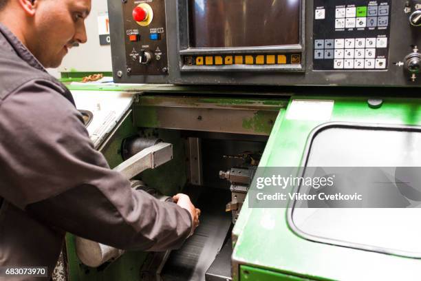worker control cnc machine production - milling cutter stock pictures, royalty-free photos & images