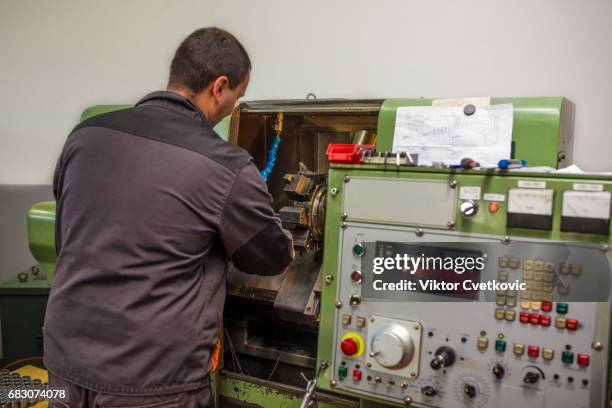 worker control cnc machine production - milling cutter stock pictures, royalty-free photos & images