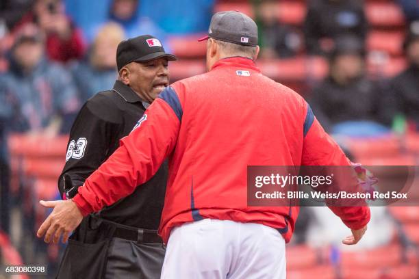 Manager John Farrell of the Boston Red Sox argues with umpire Laz Diaz during the seventh inning of a game against the Tampa Bay Rays on May 14, 2017...