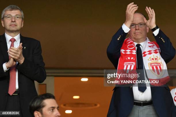 Monaco's Russian President Dmitriy Rybolovlev and Prince Albert II of Monaco applaud as they celebrate Monaco's victory at the end of the French L1...