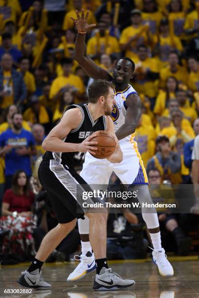 Draymond Green of the Golden State Warriors defends David Lee of the San Antonio Spurs during Game One of the NBA Western Conference Finals at ORACLE...