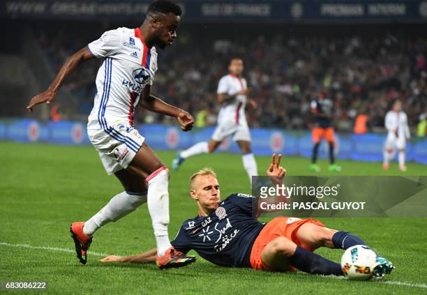 Lyon's French forward Maxwel Cornet vies with Montpellier's Czech defender Lukas Pokorny during the French L1 football match between Montpellier and...