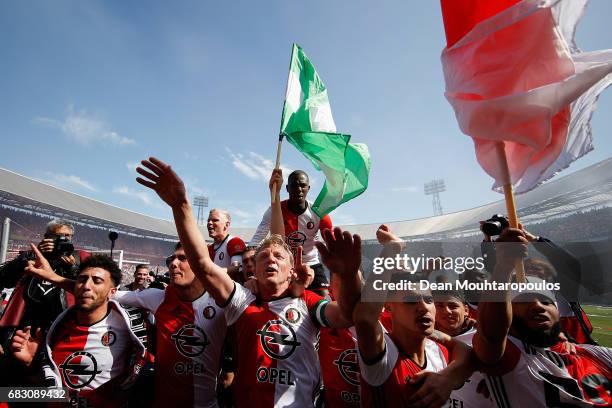 Captain, Dirk Kuyt of Feyenoord Rotterdam leads celebrations with team mates after winning the Dutch Eredivisie at De Kuip or Stadion Feijenoord on...