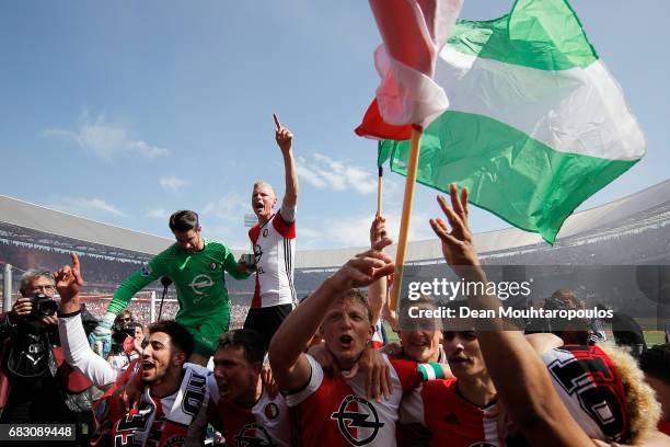 Captain, Dirk Kuyt of Feyenoord Rotterdam leads celebrations with team mates after winning the Dutch Eredivisie at De Kuip or Stadion Feijenoord on...