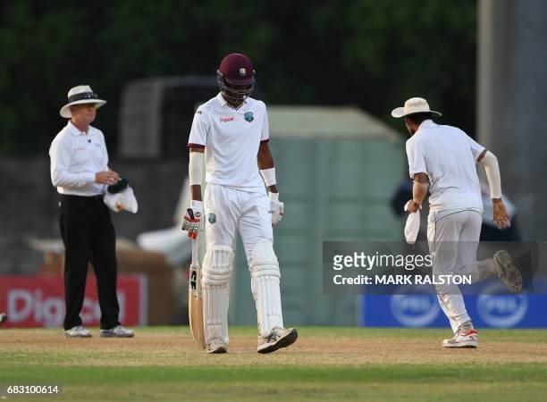 Man of the match Roston Chase of the West Indies leaves the field after being unbeaten on 101 during the final test match won by Pakistan who also...