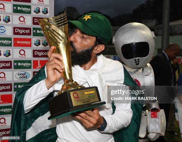 Retiring Pakistan cricket team captain Misbah-ul-Haq kisses the series trophy after winning the final test match and the series 2-1 against the West...