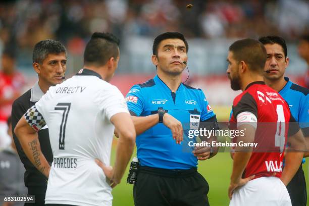 Referee Patricio Polic flips a coin prior a match between Colo Colo and Deportes Antofagasta as part of Torneo Clausura 2016-2017 at Monumental...