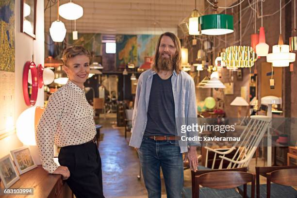 trygga butiksägare stående bland möbler - business mature couple portrait bildbanksfoton och bilder
