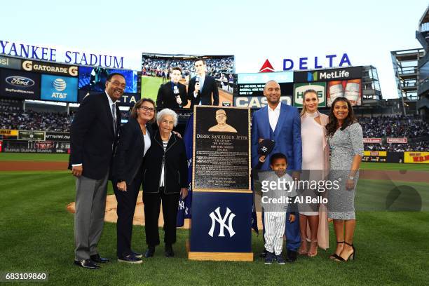 Derek Jeter poses with his family during the retirement ceremony of his number 2 jersey at Yankee Stadium on May 14, 2017 in New York City.