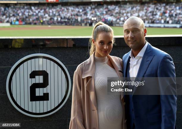 Hannah Jeter and Derek Jeter pose next to his number in Monument Park at Yankee Stadium during the retirement cerremony of Jeter's jersey at Yankee...