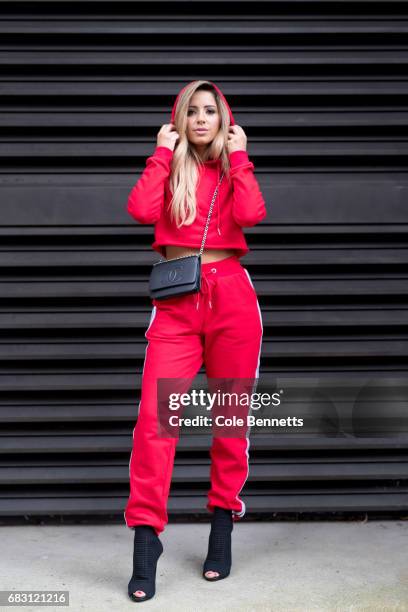 Jasmine Howell wearing I am Gallagher tracksuit and black Chanel bag and Louis Vuitton boots during Mercedes-Benz Fashion Week Resort 18 Collections...