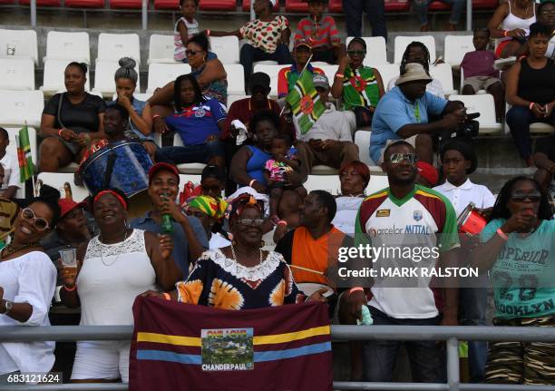 West Indies fans enjoy the cricket against Pakistan on the fifth days play of the final test match at the Windsor Park Stadium in Roseau, Dominica on...