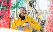 Man working on commercial fishing vessel