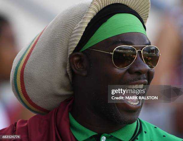 West Indies fans enjoy the cricket against Pakistan on the fifth days play of the final test match at the Windsor Park Stadium in Roseau, Dominica on...