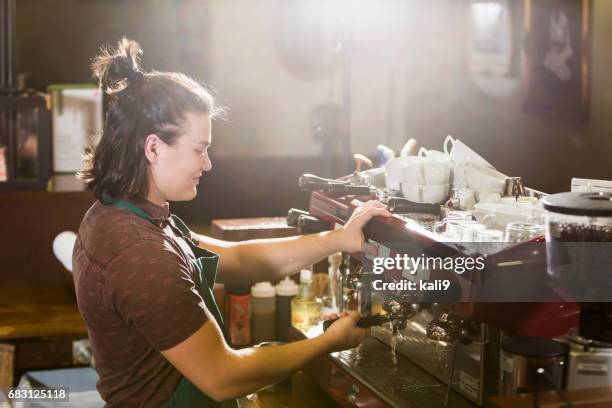young man working in coffee shop - part time worker stock pictures, royalty-free photos & images
