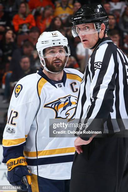 Mike Fisher of the Nashville Predators chats with linesman Shane Heyer in Game Two of the Western Conference Final against the Anaheim Ducks during...