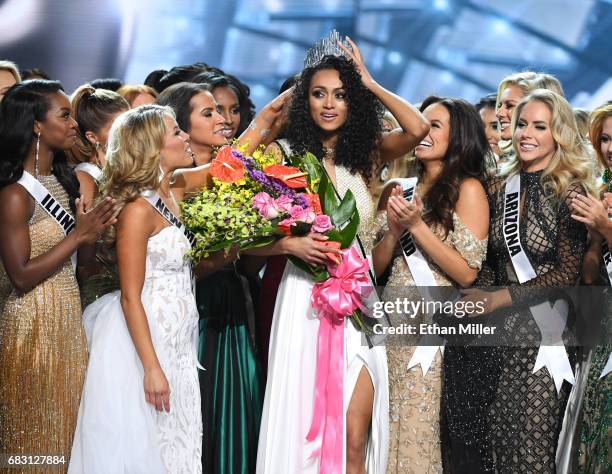 Miss District of Columbia USA 2017 Kara McCullough is surrounded by fellow contestants after she was crowned Miss USA 2017 during the 2017 Miss USA...