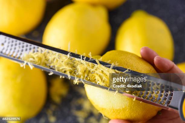 lemon zest  - zitruszeste stock-fotos und bilder