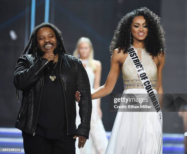 Recording artist Stephen Marley performs while escorting Miss District of Columbia USA 2017 Kara McCullough onstage during the 2017 Miss USA pageant...