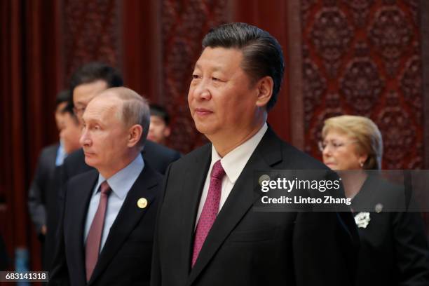 Russia's President Vladimir Putin with Chinese President Xi Jinping attends the Roundtable Summit Phase One Sessions of Belt and Road Forum at the...