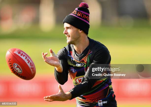 Brent Stanton of the Bombers handballs during an Essendon Bombers AFL media opportunity at Essendon Bombers Football Club on May 15, 2017 in...