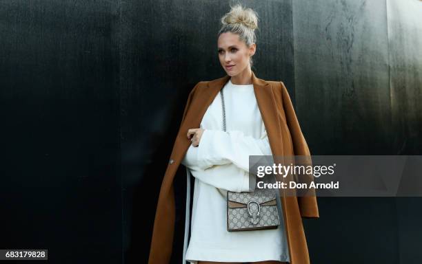 Nikki Phillips wears Puma Fenti by Rihanna jumper, Zara jacket, Gucci bag, Tony Bianco shoes during Mercedes-Benz Fashion Week Resort 18 Collections...