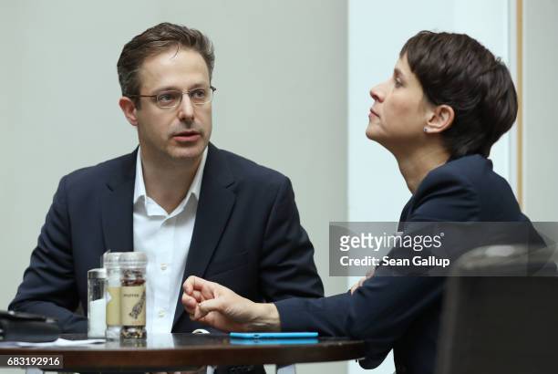 Husband and wife Frauke Petry and Marcus Pretzell, who are leading members of the populist Alternative for Germany political party, prepare to speak...