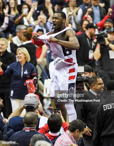 Washington Wizards guard John Wall celebrates their victory over the Boston Celtics during game six of the Eastern Conference semifinals in...