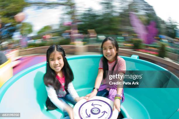 spinning tea cup ride - tea cup stock pictures, royalty-free photos & images