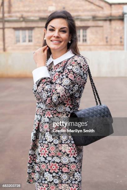 Personality and Former Miss Australia Nicole OÕNeill is wearing a Jill Sander dress and Chanel bag during Mercedes-Benz Fashion Week Resort 18...