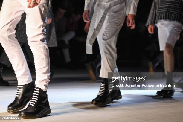 Model walks the runway during the Justin Cassin show at Mercedes-Benz Fashion Week Resort 18 Collections at Carriageworks on May 15, 2017 in Sydney,...