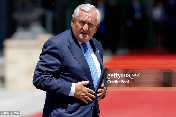 Jean-Pierre Raffarin, former Prime Minister of France arrives for a family photo with other delegation heads as they attend the Belt and Road Forum...