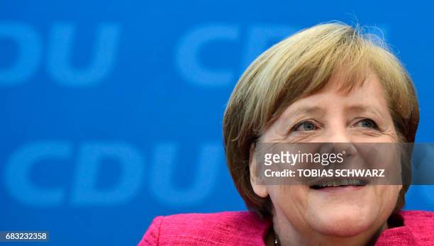 German Chancellor Angela Merkel gives a press conference at the headquarters of her conservative Christian Democratic Union party in Berlin on May 15...