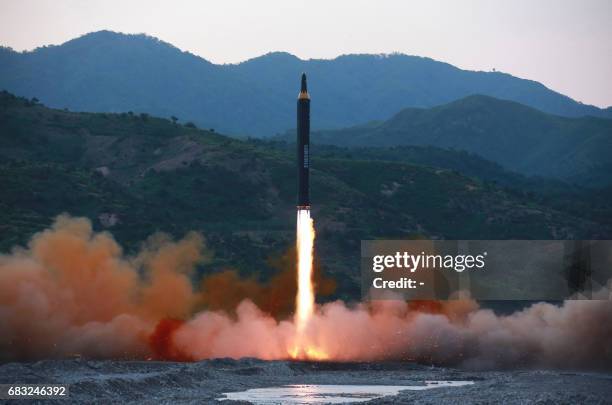 This picture taken on May 14, 2017 and released from North Korea's official Korean Central News Agency on May 15 shows a test launch of the...