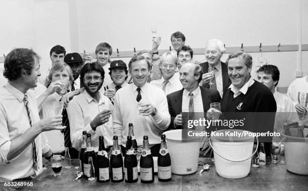 Dennis Amiss of Warwickshire celebrates what should have been his last home match with team-mates in the dressing room after the Refuge Assurance...