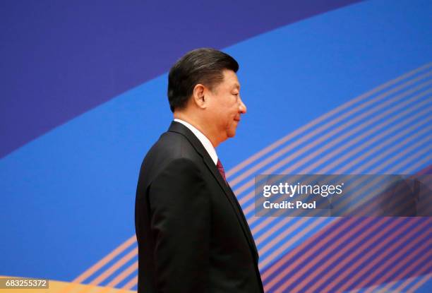 Chinese President Xi Jinping leaves a news conference at the end of the Belt and Road Forum for International Cooperation on May 15, 2017 in Beijing,...