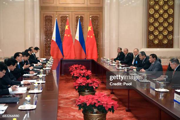 Chinese Premier Li Keqiang and Philippine President Rodrigo Duterte attend a meeting at the Great Hall of the People on May 15, 2017 in Beijing,...