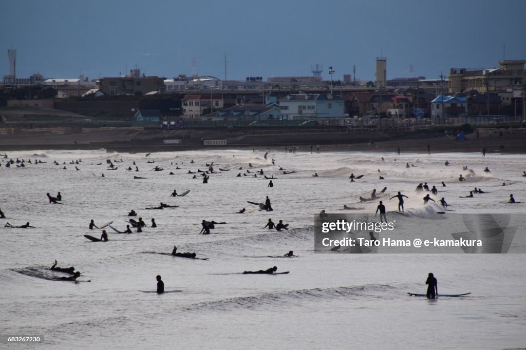 Too many surfers on the sunset beach