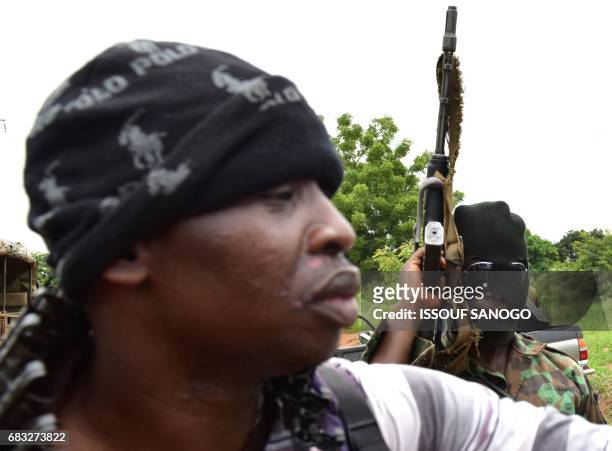 Mutinous soldiers fire in the air inside a military camp in Ivory Coast's central second city Bouake, on May 15, 2017. Gunshots rang out early on May...
