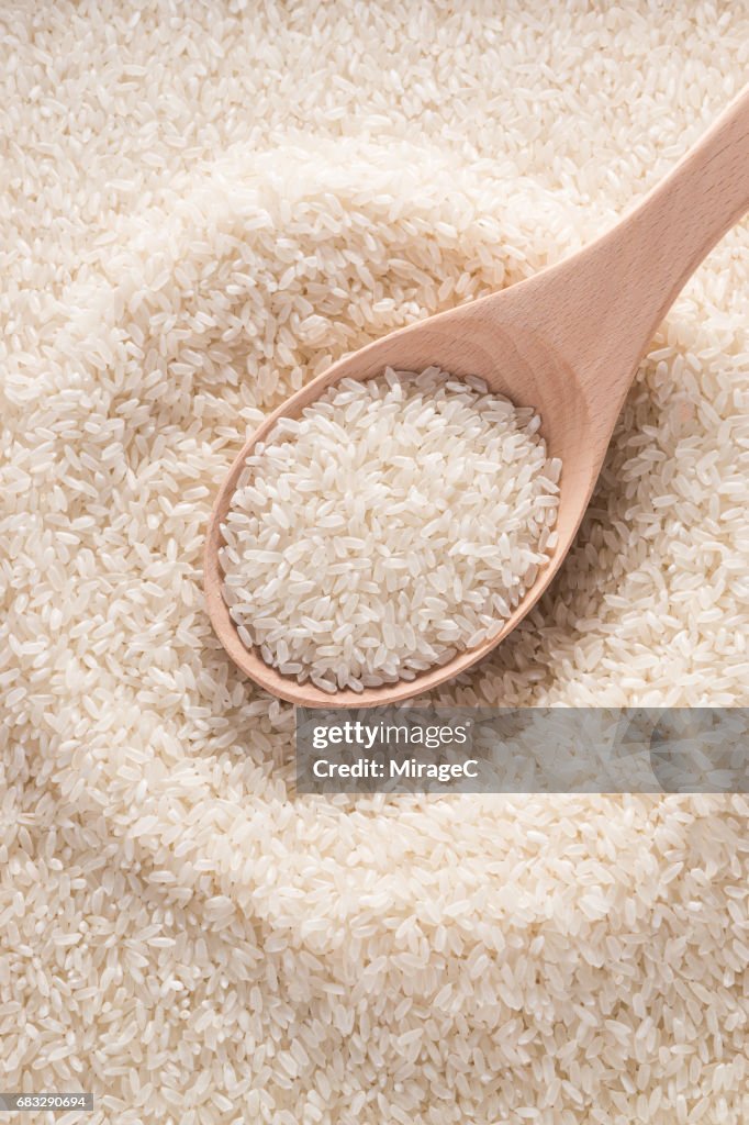 Wood Spoon Full of Uncooked Rice