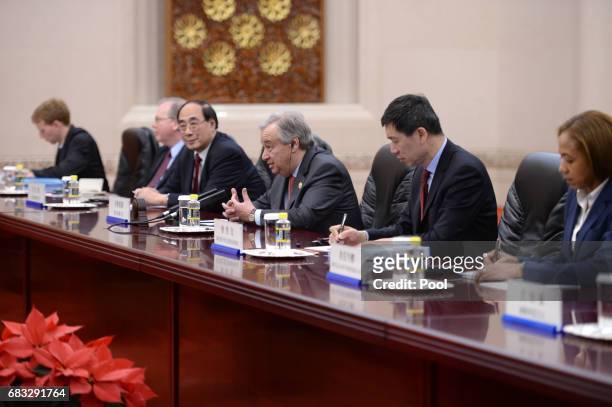 United Nations Secretary-General Antonio Guterres talks to Chinese Premier Li Keqiang during their meeting on May 15, 2017 at the Great Hall of the...