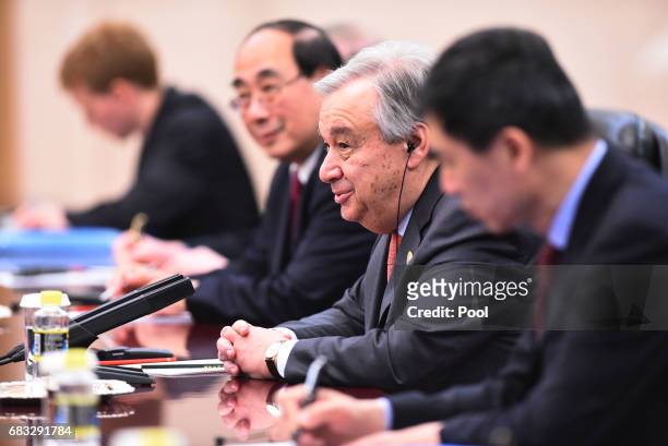 United Nations Secretary-General Antonio Guterres speaks to Chinese Premier Li Keqiang during their meeting on May 15, 2017 at the Great Hall of the...