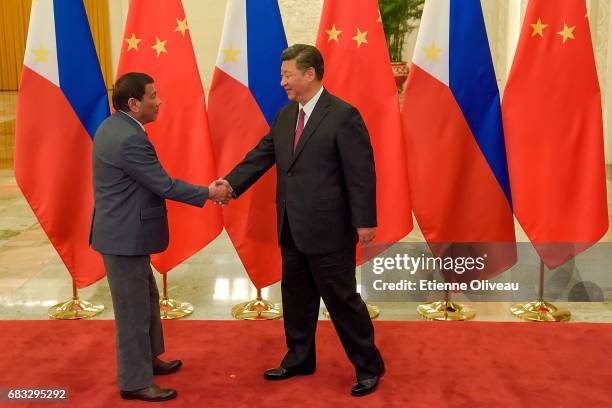 Chinese President Xi Jinping shakes hands with Philippines President Rodrigo Duterte prior to their bilateral meeting during the Belt and Road Forum...