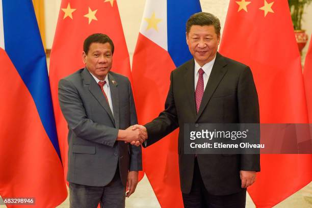 Chinese President Xi Jinping shakes hands with Philippines President Rodrigo Duterte prior to their bilateral meeting during the Belt and Road Forum...