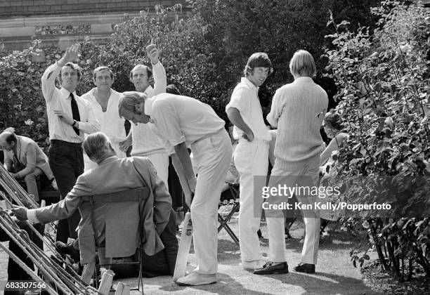 England players gather in the Harris Memorial Gardens as play is suspended due to a bomb scare during the 3rd Test match between England and West...