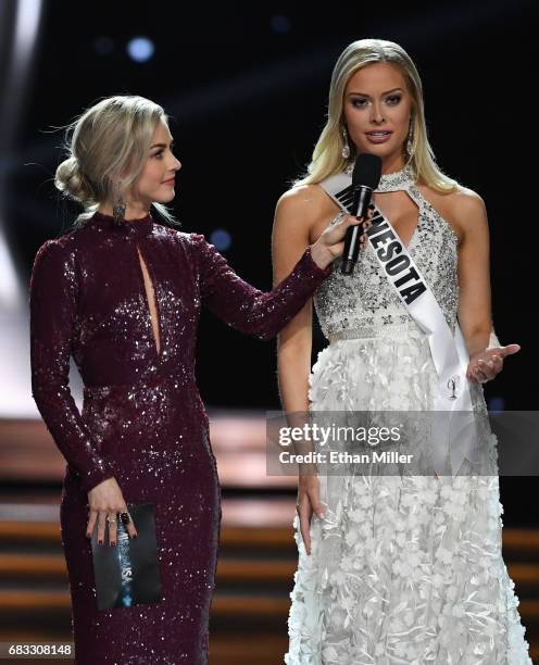 Co-host Julianne Hough looks on as Miss Minnesota USA 2017 Meridith Gould answers a question during the interview portion of the 2017 Miss USA...