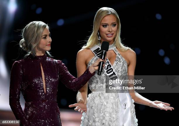 Co-host Julianne Hough looks on as Miss Minnesota USA 2017 Meridith Gould answers a question during the interview portion of the 2017 Miss USA...