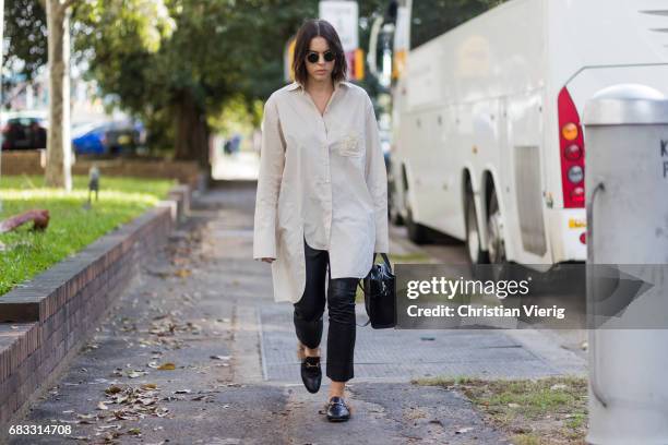 Guest wearing an oversized button shirt with long sleeves at day 2 during Mercedes-Benz Fashion Week Resort 18 Collections at Carriageworks on May...