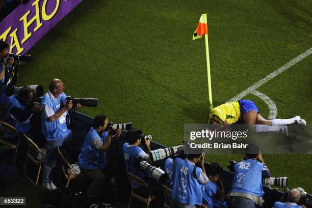 Rivaldo of Brazil lies on the ground after being struck by the ball during the Group C match against Turkey at the World Cup Group Stage played at...